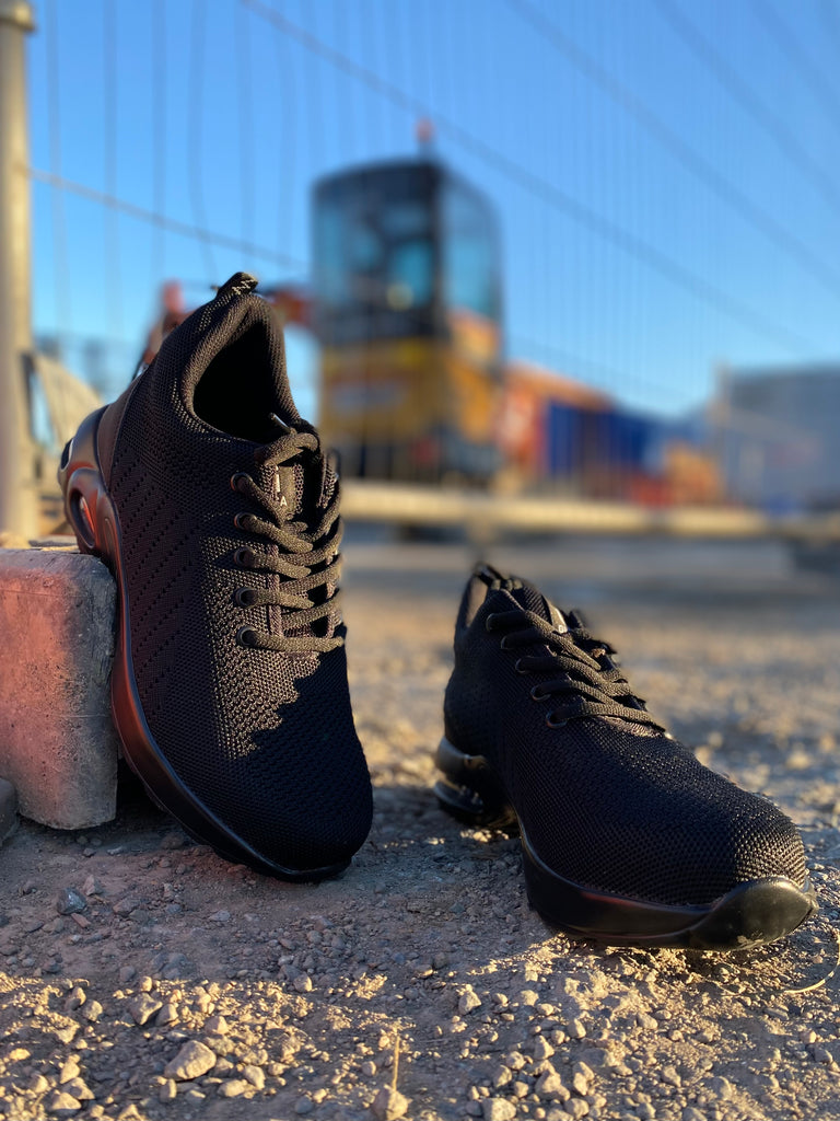black steel toe cap safety shoes on a construction site